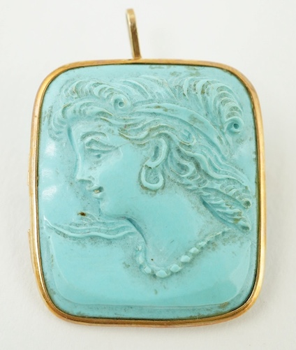 A yellow metal mounted turquoise? set pendant brooch, carved with the bust of a lady to dexter, 27mm. Condition - fair